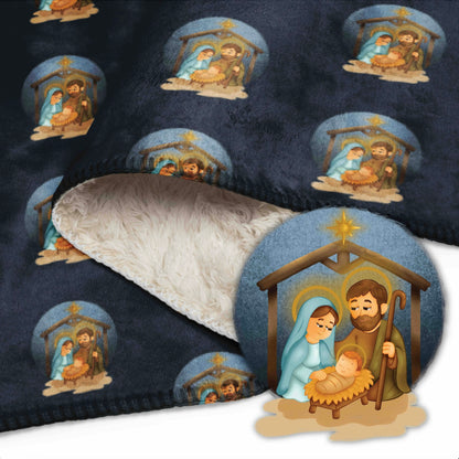 Decorative blanket with nativity scene pattern on a dark blue background